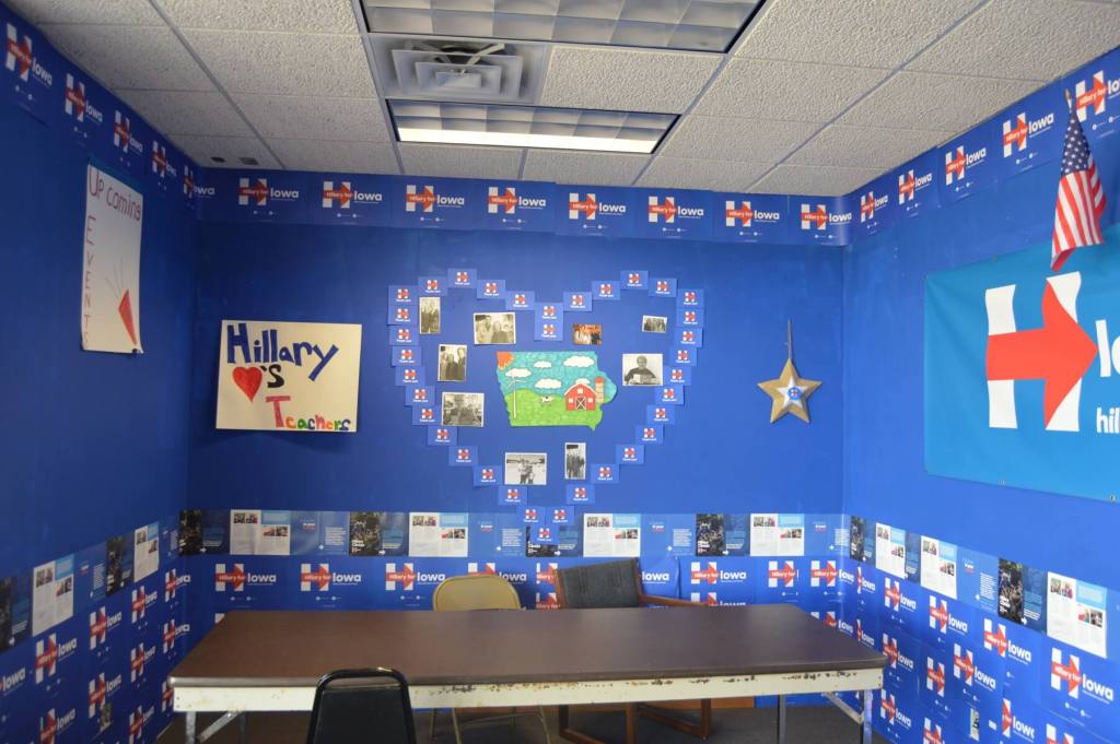 A wall with volunteer pictures