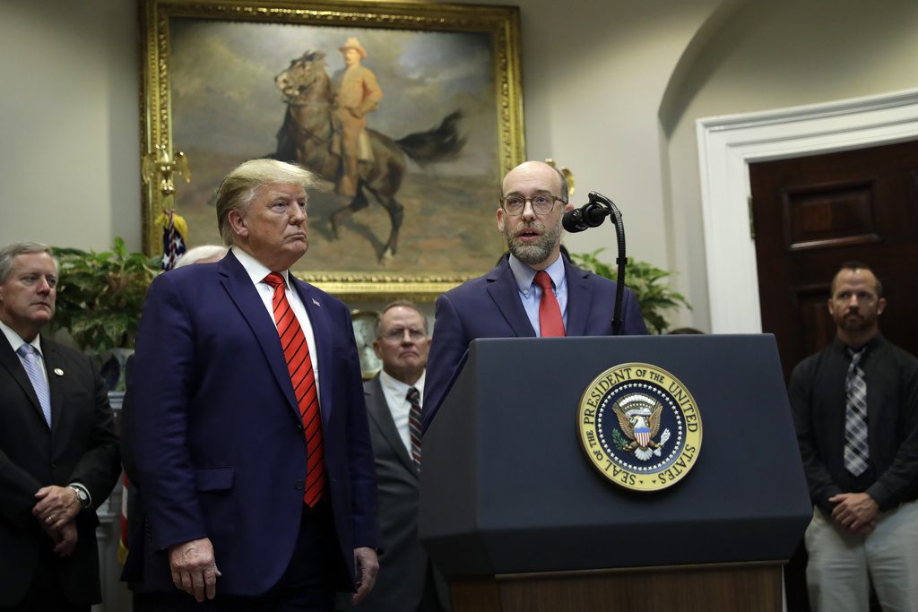 FILE - President Donald Trump listens as acting director of the Office of Management and Budget Russel Vought speaks during an event on "transparency in Federal guidance and enforcement" in the Roosevelt Room of the White House, Wednesday, Oct. 9, 2019, in Washington. (AP Photo/Evan Vucci, File)