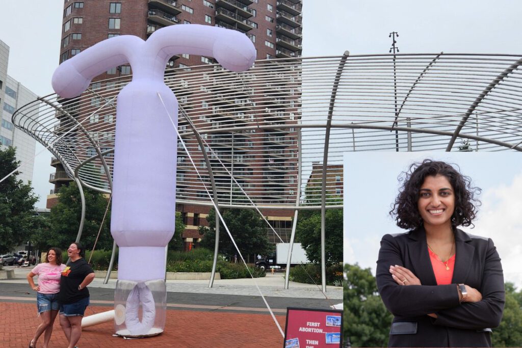 a picture of a light purple inflatable IUD in downtown Des Moines with Dr. Megan Srinivas' headshot in the bottom right corner