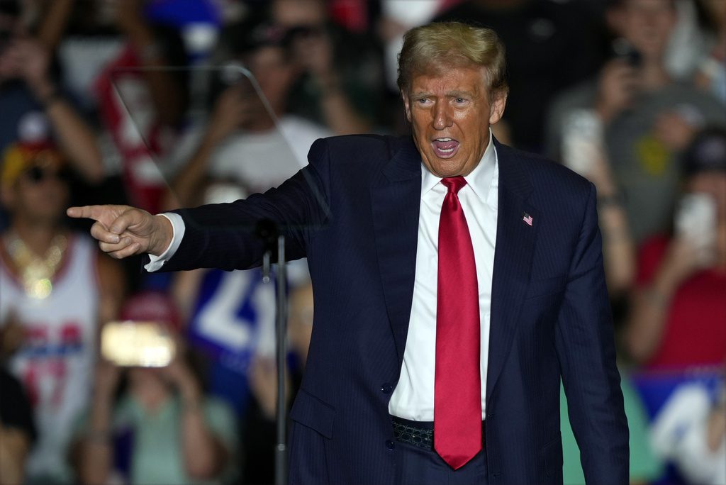 Republican presidential nominee former President Donald Trump gestures to supporters at a campaign rally at Greensboro Coliseum, Tuesday, Oct. 22, 2024, in Greensboro, N.C. (AP Photo/Julia Demaree Nikhinson)