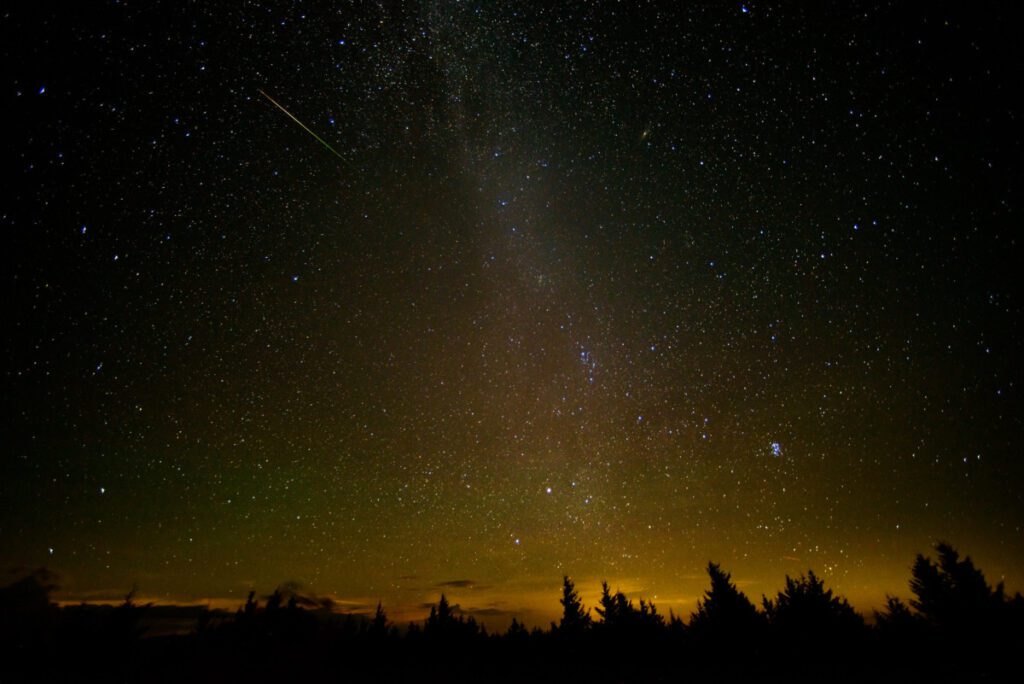 Meteor shower in the night sky.