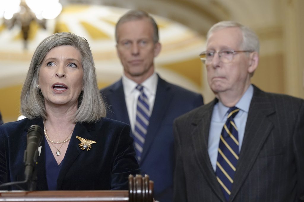 Sen. Joni Ernst, R-Iowa, left, talks at a news conference after a policy luncheon on Capitol Hill Wednesday, Jan. 17, 2024, as Sen. John Thune, R-S.D., center, and Sen. Minority Leader Mitch McConnell, R-Ky., right, listen in Washington. (AP Photo/Mariam Zuhaib)