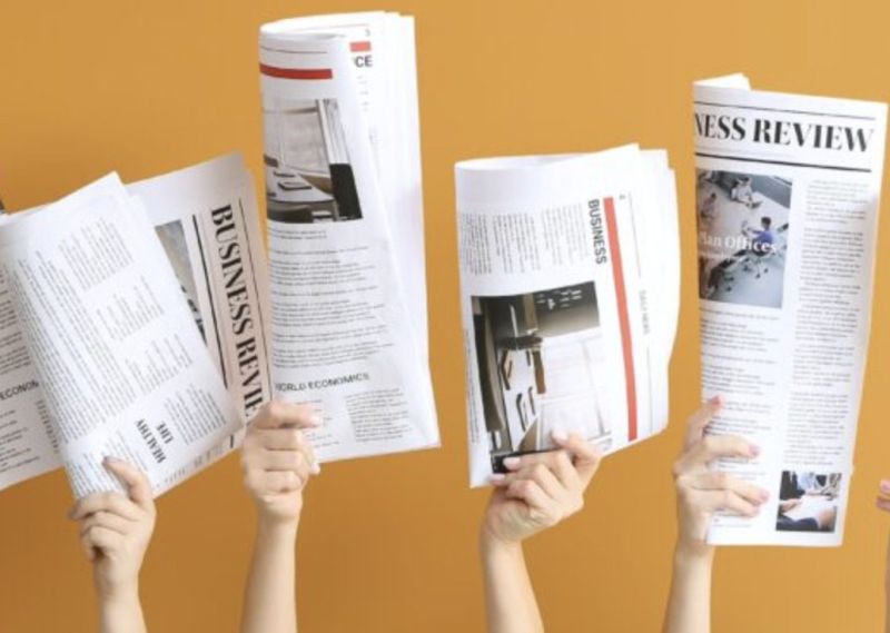 hands with headlines