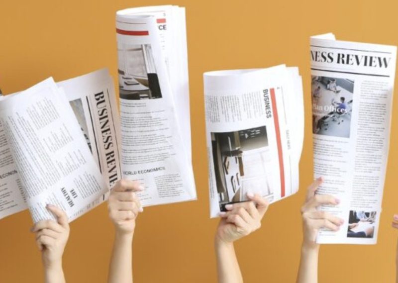 hands with headlines