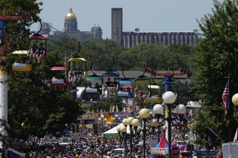 an aerial view of the crowd and some rides at the iowa state fair.