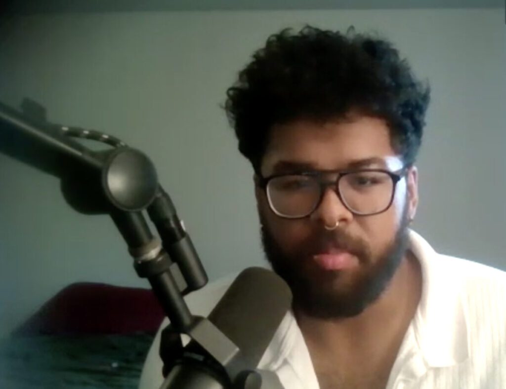 Jacob Scroggins, a shift supervisor at the Starbucks on Merle Hay Road in Des Moines, talks about the effort to unionize his store in a screenshot from a video call with Iowa Starting Line.