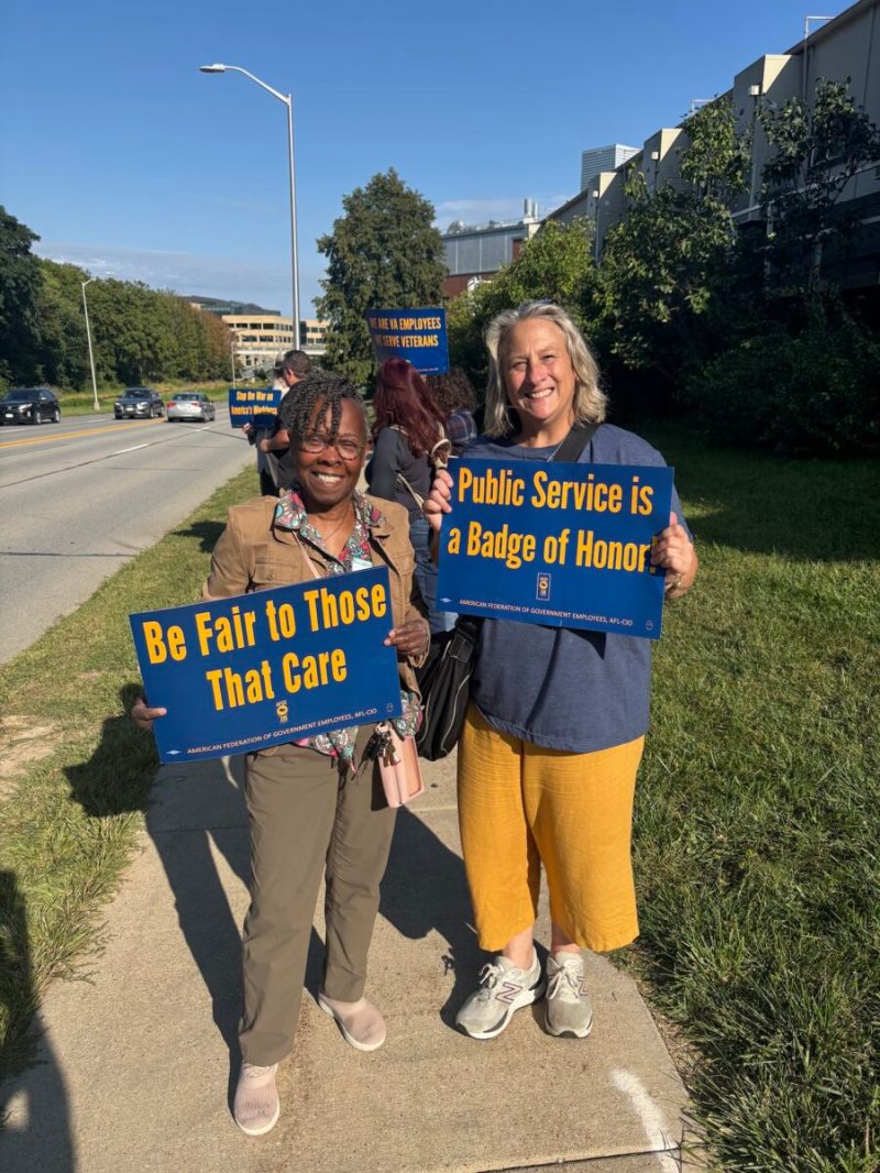 People hold up signs during the Save Our VA rally in Iowa City on Aug. 27, 2025. (Courtesy Iowa Federation of Labor)