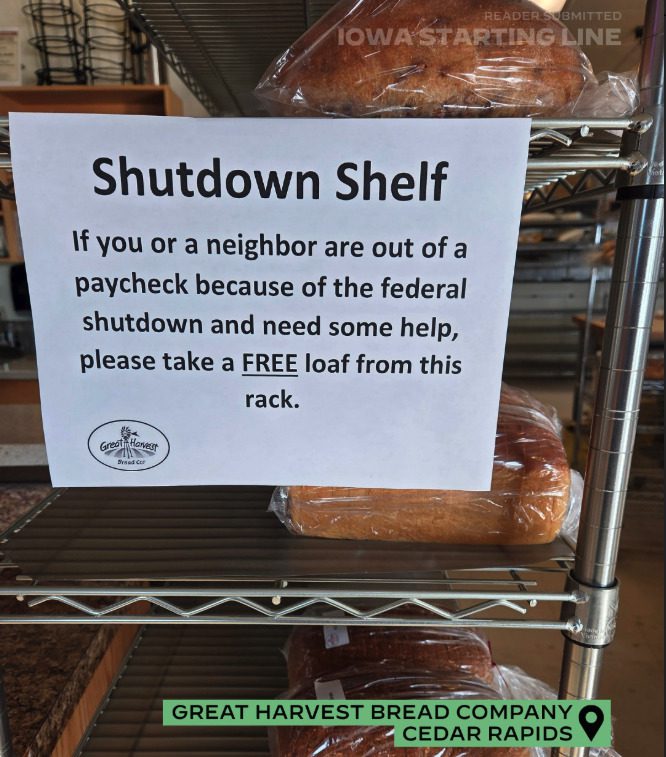A photo of a sign at Great Harvest Bread Company in Cedar Rapids, taken during the federal government shutdown in October 2025, that reads, "Shutdown Shelf: If you or a neighbor are out of a paycheck because of the federal shutdown and need some help, please take a FREE loaf from this rack."(Reader submitted)