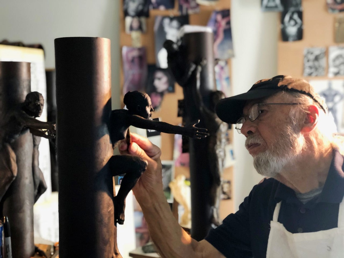 Tom Schomberg works in his studio on figures