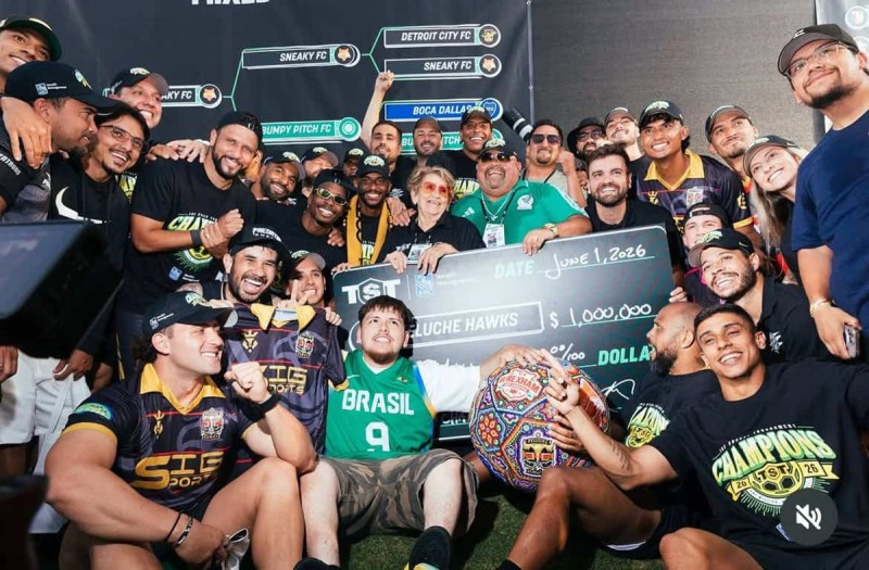 A soccer team celebrates after winning a tournament