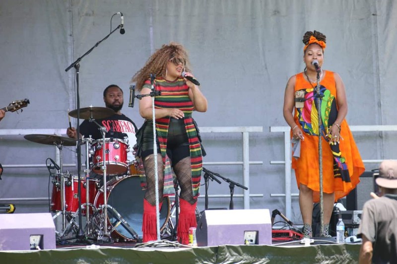 Performers on stage at a Juneteenth event.